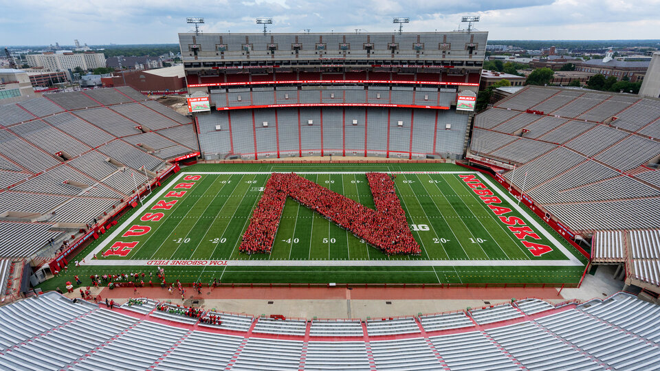 New students forming the letter N in Memorial Stadium during the new student enrollment tunnel walk